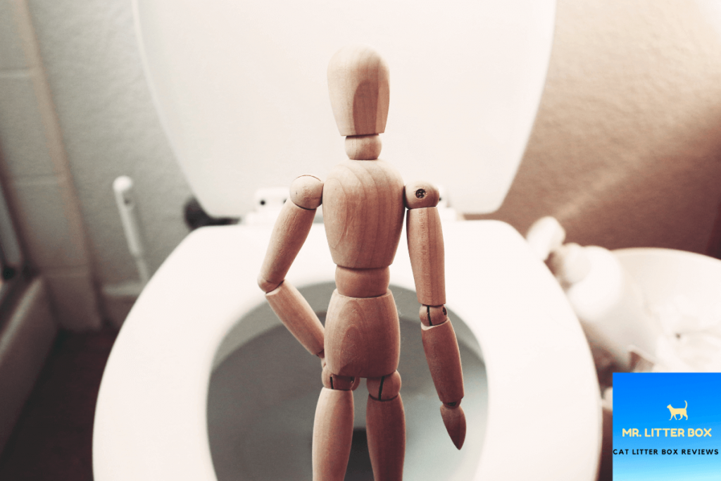 Robot urinating in a toilet bowl